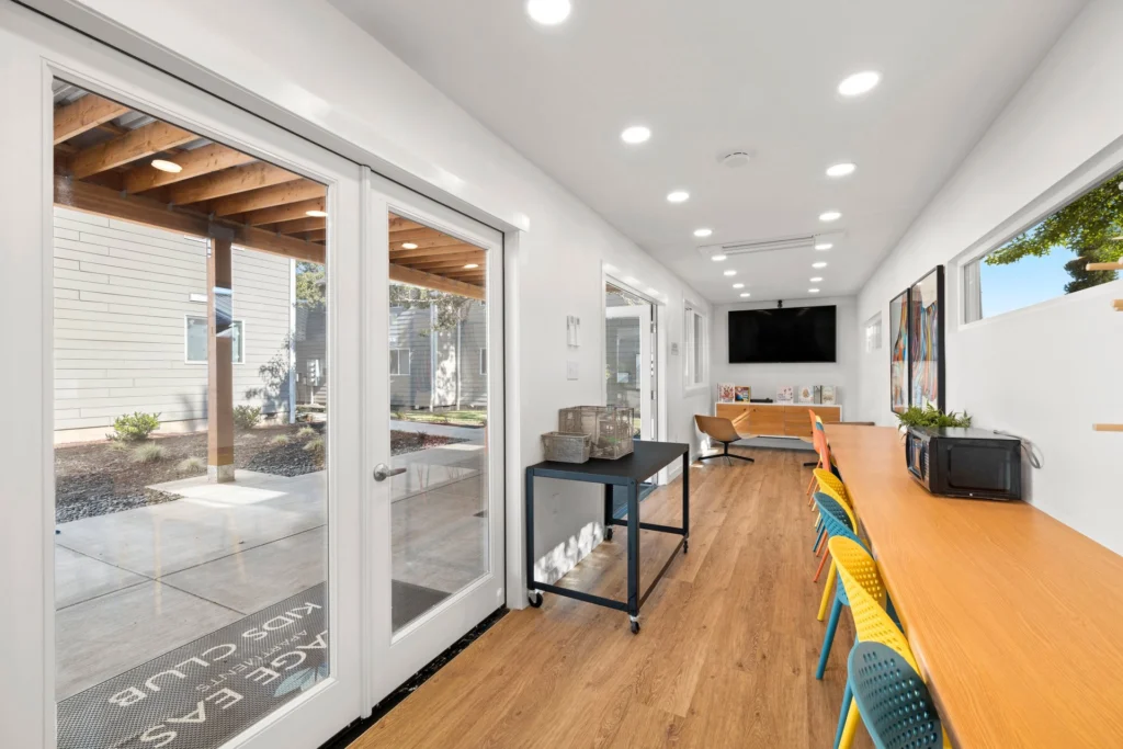 Kids club with a long table and chairs and a TV