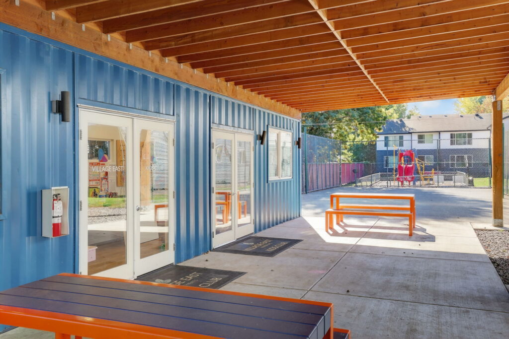Covered patio outside the kids club with picnic table